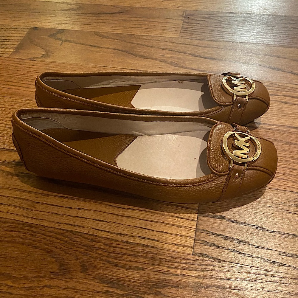 Michael Kors flats with gold emblem